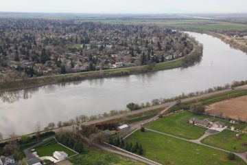 An aerial view of the Sacramento River in Sacramento, Calif., taken March 17, 2010. (U.S. Army photo by Michael J. Nevins/Released) The view is looking almost due south, taken from an altitude of approximately 300 feet, at an approximate location of 38° 31' 06" N - 121° 32' 56" W, with the foreground on the west side of the river. The neighborhood seen in the background of the image is known as the Pocket. Significant work was done on levees on this section of the river over the next decade since this picture was taken.